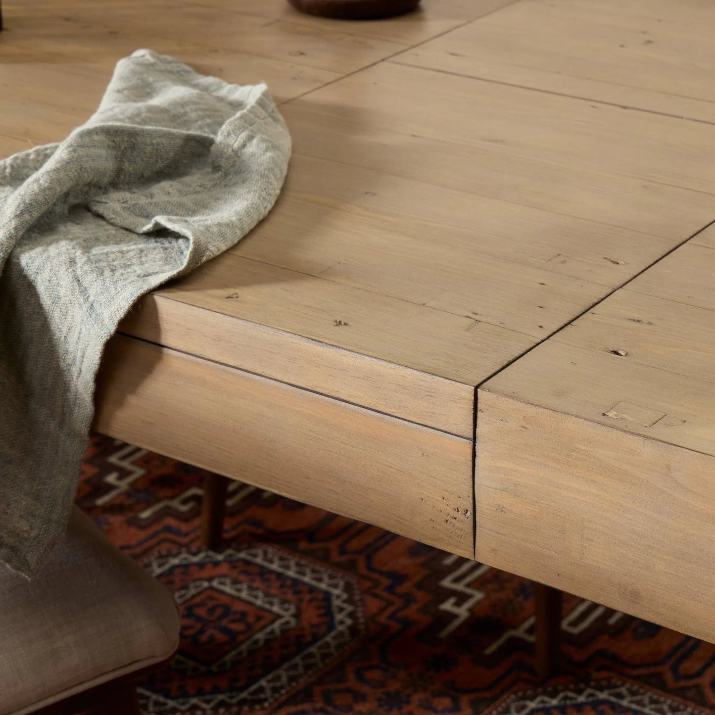 018 SI-1901828 | Closeup | Everson Dining Table by Four Hands in scrubbed teak. Made from solid mixed reclaimed wood in a transitional style.