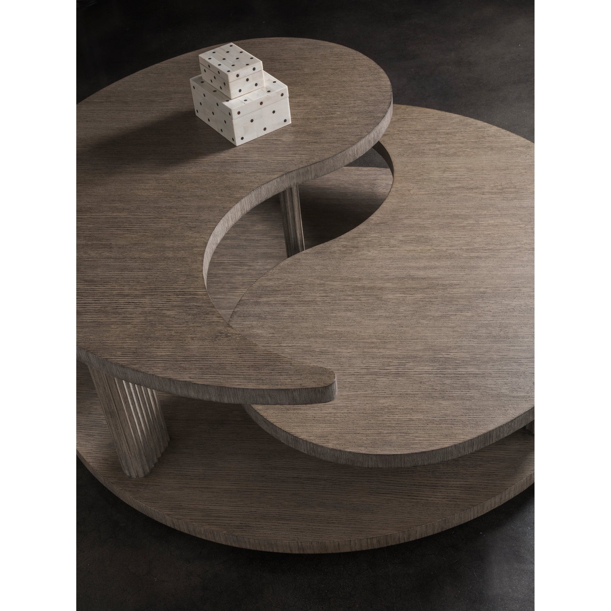 Yin Yang Round Cocktail Table by Artistica Home in cappuccino gray. Made from unique in a modern style.