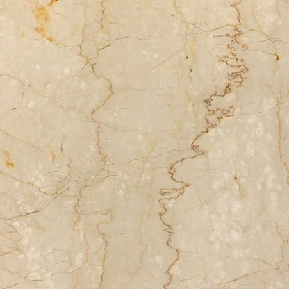 Arum Dining Table by Four Hands in cream marble. Made from solid marble in a coastal style.
