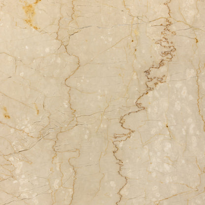Arum Dining Table by Four Hands in cream marble. Made from solid marble in a coastal style.