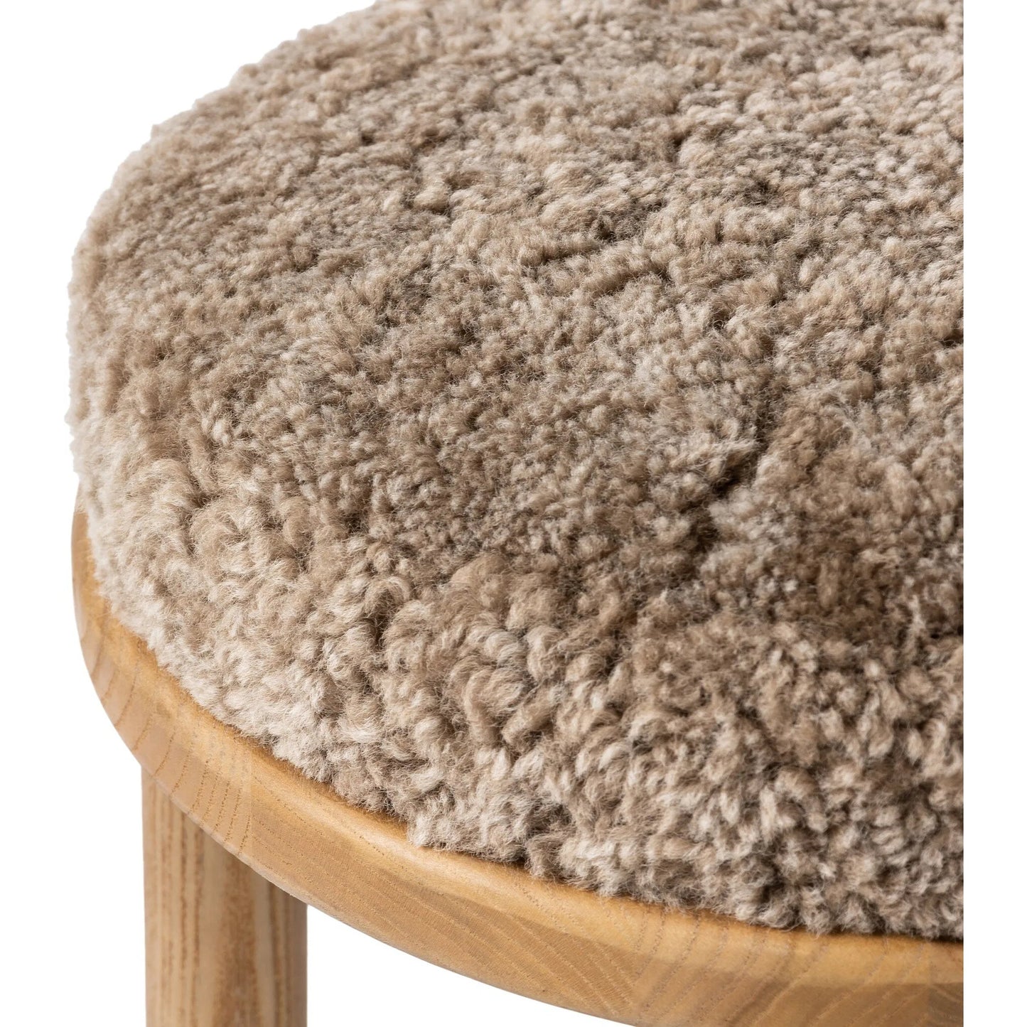 006 SI-2535319 | Closeup | Saldino Bar Stool by Four Hands in taupe shearling, sandy nettlewood. Made from shearling, solid nettlewood in a unique style.