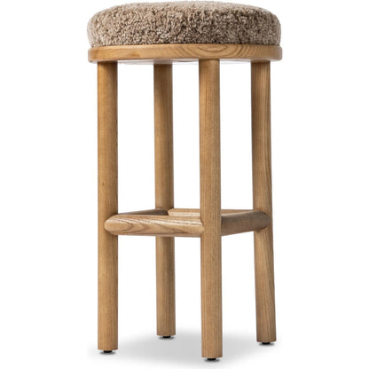 Saldino Bar Stool by Four Hands in taupe shearling, sandy nettlewood. Made from shearling, solid nettlewood in a unique style.