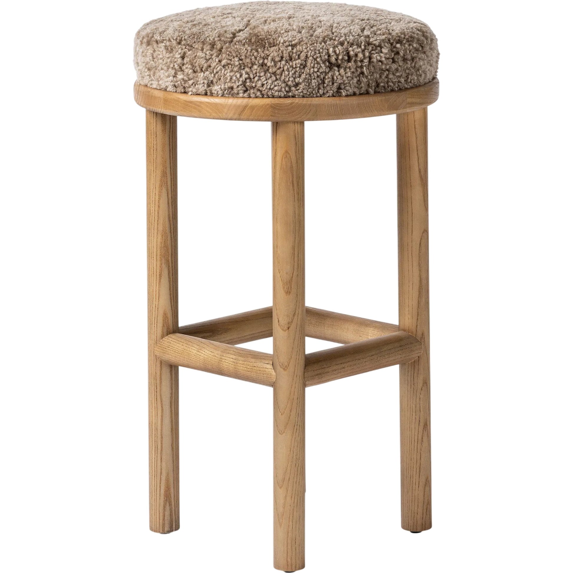 Saldino Bar Stool by Four Hands in taupe shearling, sandy nettlewood. Made from shearling, solid nettlewood in a unique style.
