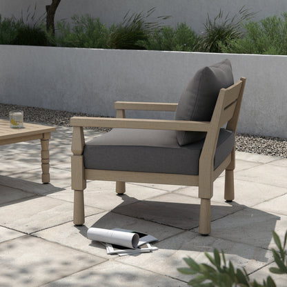 Waller Outdoor Chair by Four Hands in stone grey, weathered grey and weathered grey in stone grey. Made from 100% olefin, solid fsc®-certified teak, 59% polyurethane foam, 30% polyester fiber, 11% polyester fiber batting in a transitio