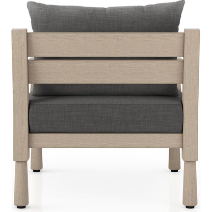 Waller Outdoor Chair by Four Hands in stone grey, weathered grey and weathered grey in stone grey. Made from 100% olefin, solid fsc®-certified teak, 59% polyurethane foam, 30% polyester fiber, 11% polyester fiber batting in a transitio