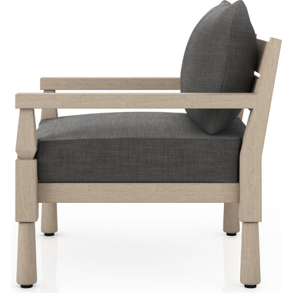 Waller Outdoor Chair by Four Hands in stone grey, weathered grey and weathered grey in stone grey. Made from 100% olefin, solid fsc®-certified teak, 59% polyurethane foam, 30% polyester fiber, 11% polyester fiber batting in a transitio