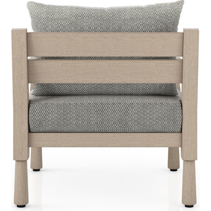 Waller Outdoor Chair by Four Hands in stone grey, weathered grey and weathered grey in stone grey. Made from 100% olefin, solid fsc®-certified teak, 59% polyurethane foam, 30% polyester fiber, 11% polyester fiber batting in a transitio