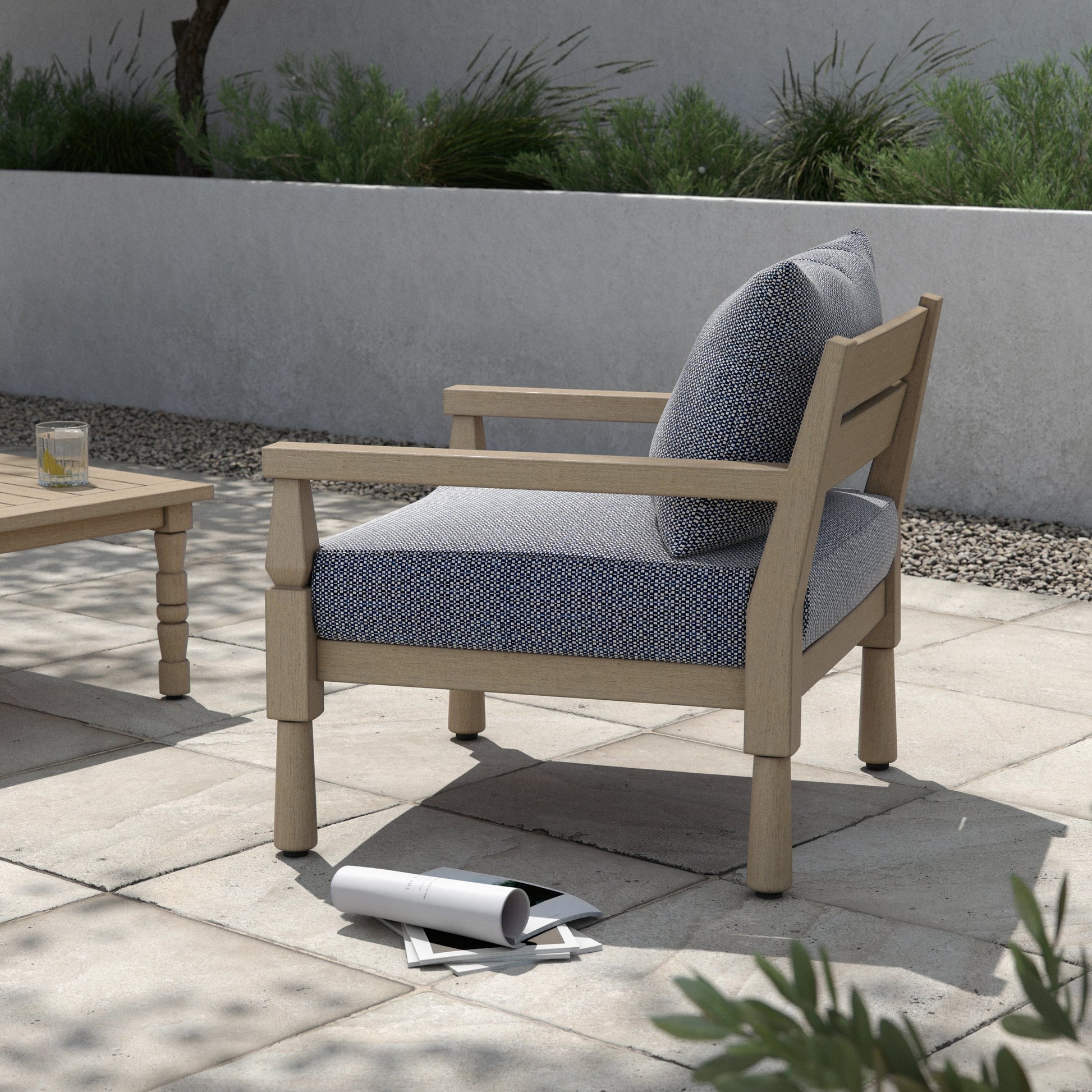 Waller Outdoor Chair by Four Hands in stone grey, weathered grey and weathered grey in stone grey. Made from 100% olefin, solid fsc®-certified teak, 59% polyurethane foam, 30% polyester fiber, 11% polyester fiber batting in a transitio