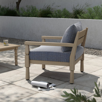 Waller Outdoor Chair by Four Hands in stone grey, weathered grey and weathered grey in stone grey. Made from 100% olefin, solid fsc®-certified teak, 59% polyurethane foam, 30% polyester fiber, 11% polyester fiber batting in a transitio