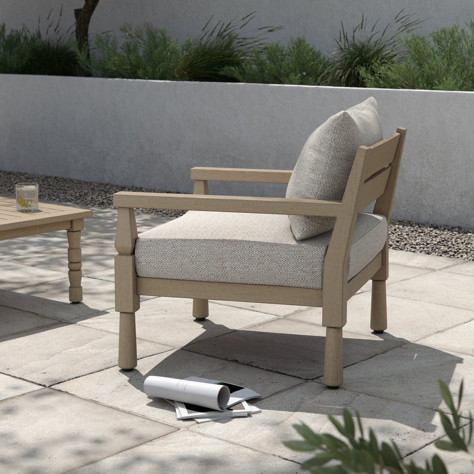 Waller Outdoor Chair by Four Hands in stone grey, weathered grey and weathered grey in stone grey. Made from 100% olefin, solid fsc®-certified teak, 59% polyurethane foam, 30% polyester fiber, 11% polyester fiber batting in a transitio