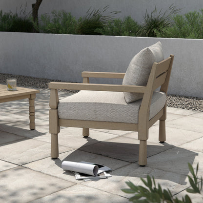 Waller Outdoor Chair by Four Hands in stone grey, weathered grey and weathered grey in stone grey. Made from 100% olefin, solid fsc®-certified teak, 59% polyurethane foam, 30% polyester fiber, 11% polyester fiber batting in a transitio