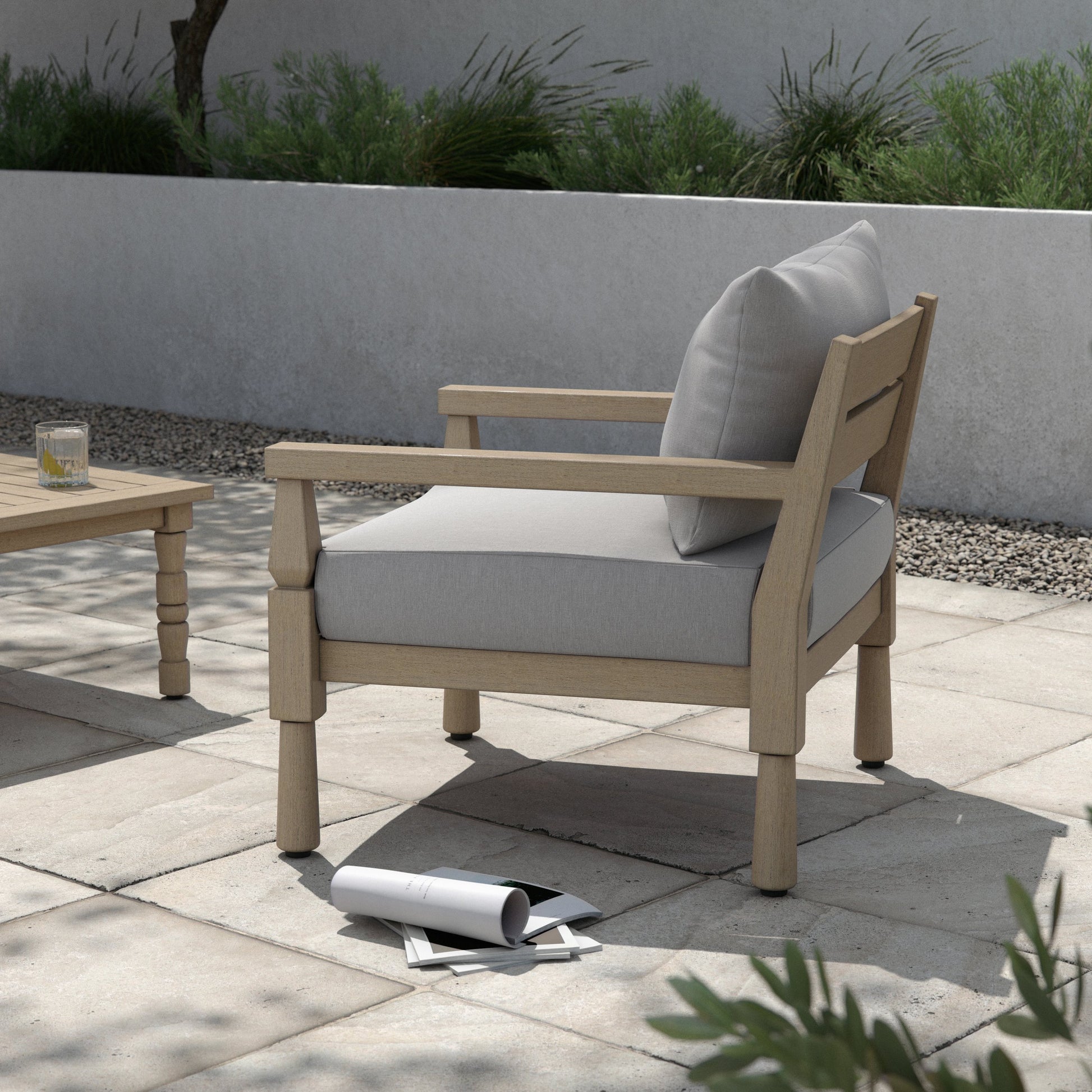 Waller Outdoor Chair by Four Hands in stone grey, weathered grey and weathered grey in stone grey. Made from 100% olefin, solid fsc®-certified teak, 59% polyurethane foam, 30% polyester fiber, 11% polyester fiber batting in a transitio