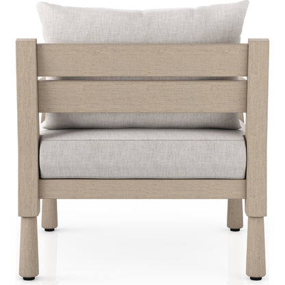 Waller Outdoor Chair by Four Hands in stone grey, weathered grey and weathered grey in stone grey. Made from 100% olefin, solid fsc®-certified teak, 59% polyurethane foam, 30% polyester fiber, 11% polyester fiber batting in a transitio