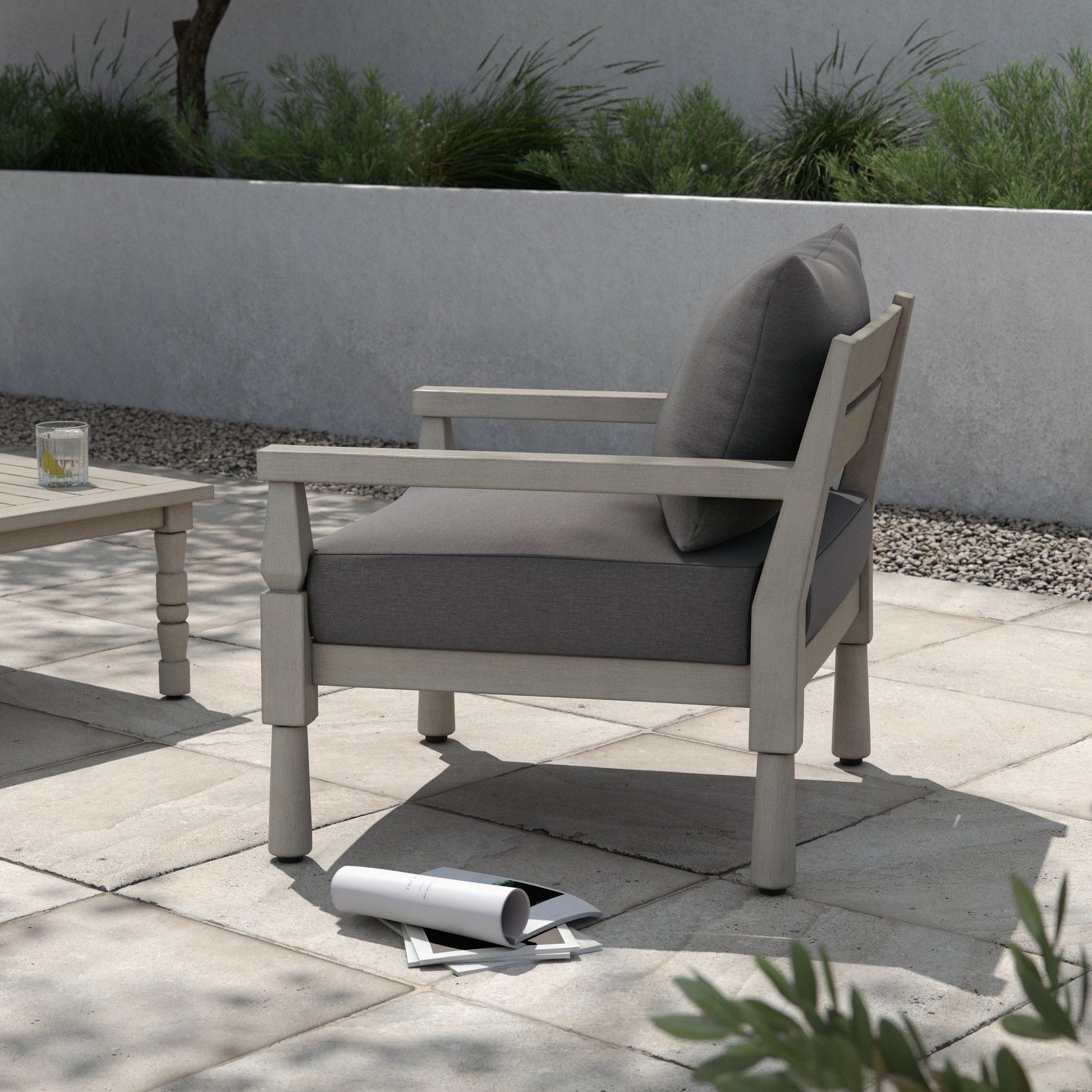Waller Outdoor Chair by Four Hands in stone grey, weathered grey and weathered grey in stone grey. Made from 100% olefin, solid fsc®-certified teak, 59% polyurethane foam, 30% polyester fiber, 11% polyester fiber batting in a transitio