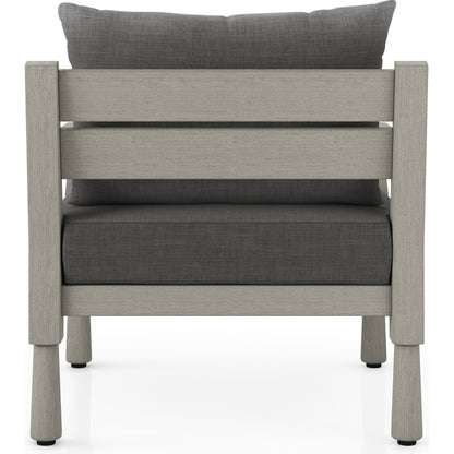 Waller Outdoor Chair by Four Hands in stone grey, weathered grey and weathered grey in stone grey. Made from 100% olefin, solid fsc®-certified teak, 59% polyurethane foam, 30% polyester fiber, 11% polyester fiber batting in a transitio