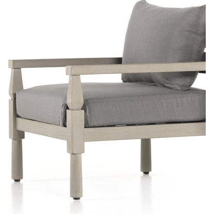 Waller Outdoor Chair by Four Hands in stone grey, weathered grey and weathered grey in stone grey. Made from 100% olefin, solid fsc®-certified teak, 59% polyurethane foam, 30% polyester fiber, 11% polyester fiber batting in a transitio