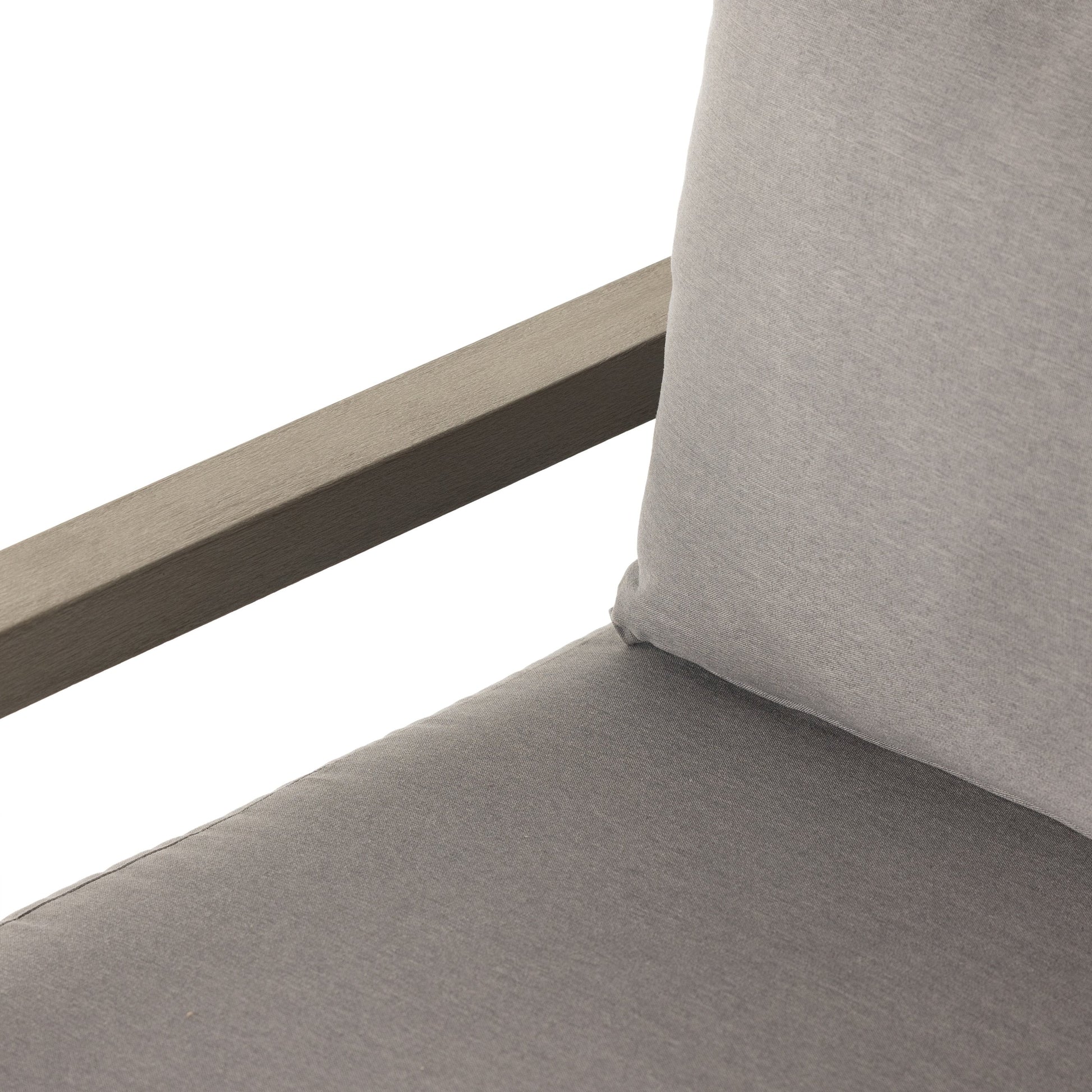 Waller Outdoor Chair by Four Hands in stone grey, weathered grey and weathered grey in stone grey. Made from 100% olefin, solid fsc®-certified teak, 59% polyurethane foam, 30% polyester fiber, 11% polyester fiber batting in a transitio