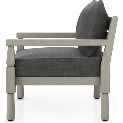 Waller Outdoor Chair by Four Hands in stone grey, weathered grey and weathered grey in stone grey. Made from 100% olefin, solid fsc®-certified teak, 59% polyurethane foam, 30% polyester fiber, 11% polyester fiber batting in a transitio