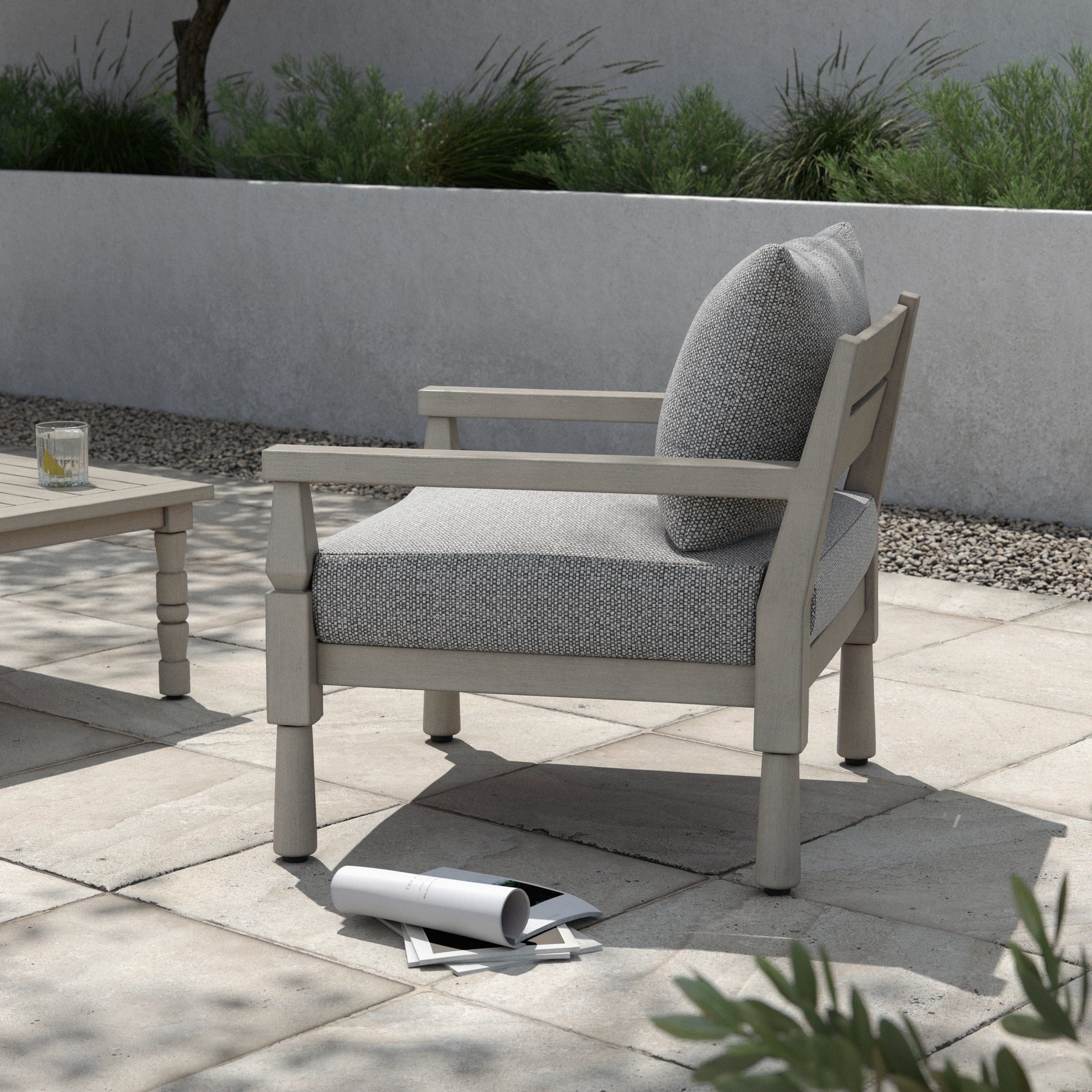 Waller Outdoor Chair by Four Hands in stone grey, weathered grey and weathered grey in stone grey. Made from 100% olefin, solid fsc®-certified teak, 59% polyurethane foam, 30% polyester fiber, 11% polyester fiber batting in a t