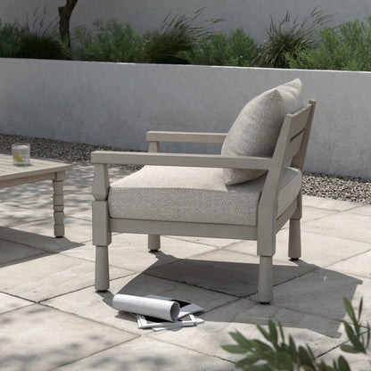 Waller Outdoor Chair by Four Hands in stone grey, weathered grey and weathered grey in stone grey. Made from 100% olefin, solid fsc®-certified teak, 59% polyurethane foam, 30% polyester fiber, 11% polyester fiber batting in a transitio