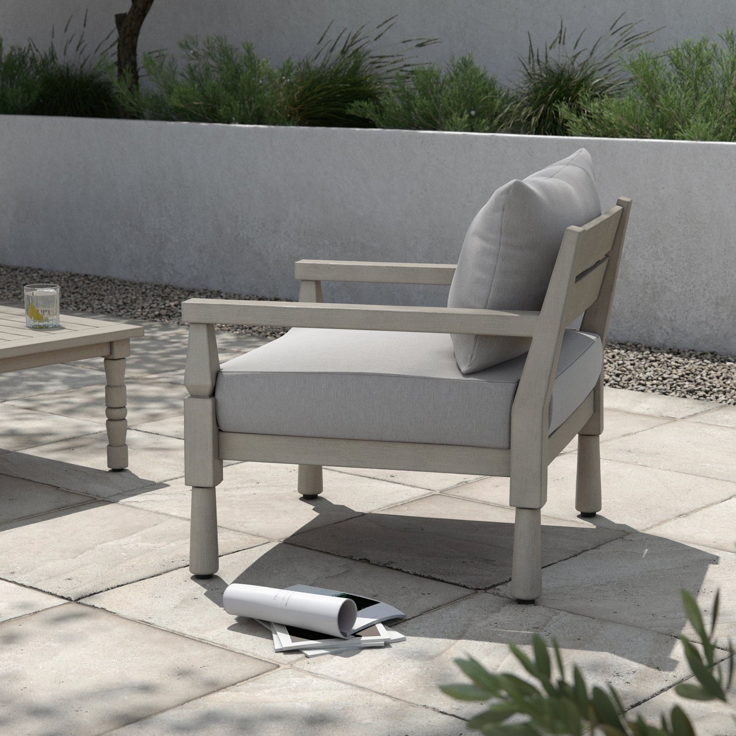 010 SI-1902752 | Lifestyle | Waller Outdoor Chair by Four Hands in stone grey, weathered grey and weathered grey in stone grey. Made from 100% olefin, solid fsc®-certified teak, 59% polyurethane foam, 30% polyester fiber, 11% polyester fiber batting in a t