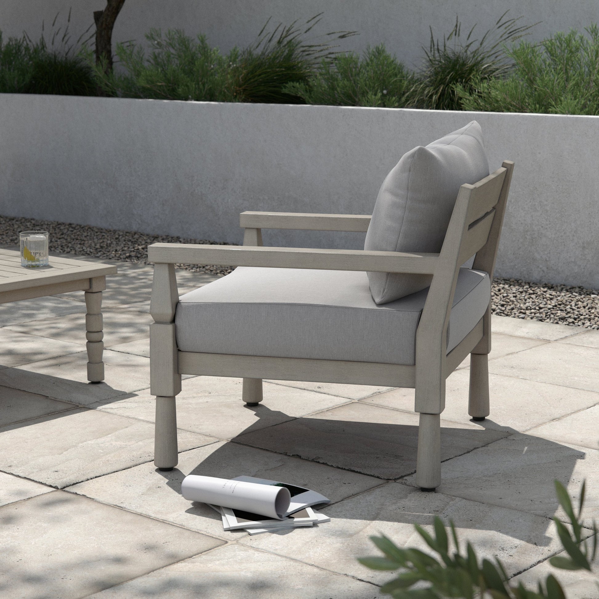 Waller Outdoor Chair by Four Hands in stone grey, weathered grey and weathered grey in stone grey. Made from 100% olefin, solid fsc®-certified teak, 59% polyurethane foam, 30% polyester fiber, 11% polyester fiber batting in a t