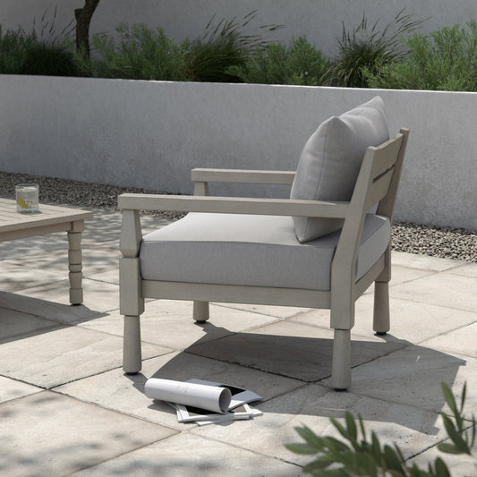 Waller Outdoor Chair by Four Hands in stone grey, weathered grey and weathered grey in stone grey. Made from 100% olefin, solid fsc®-certified teak, 59% polyurethane foam, 30% polyester fiber, 11% polyester fiber batting in a t