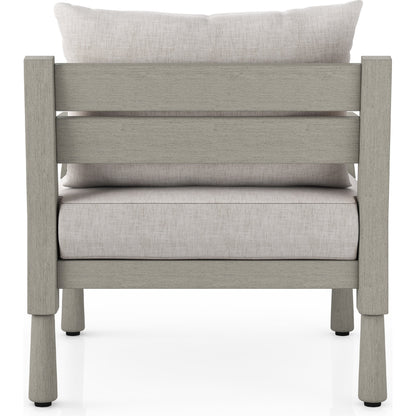 Waller Outdoor Chair by Four Hands in stone grey, weathered grey and weathered grey in stone grey. Made from 100% olefin, solid fsc®-certified teak, 59% polyurethane foam, 30% polyester fiber, 11% polyester fiber batting 