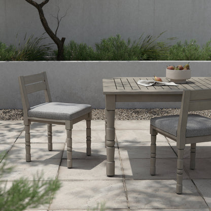 Waller Outdoor Dining Chair, Weathered Grey by Four Hands in weathered grey. Made from 100% olefin, solid fsc®-certified teak, 91% polyurethane foam pad, 9% polyester fiber batting in a transitional style.