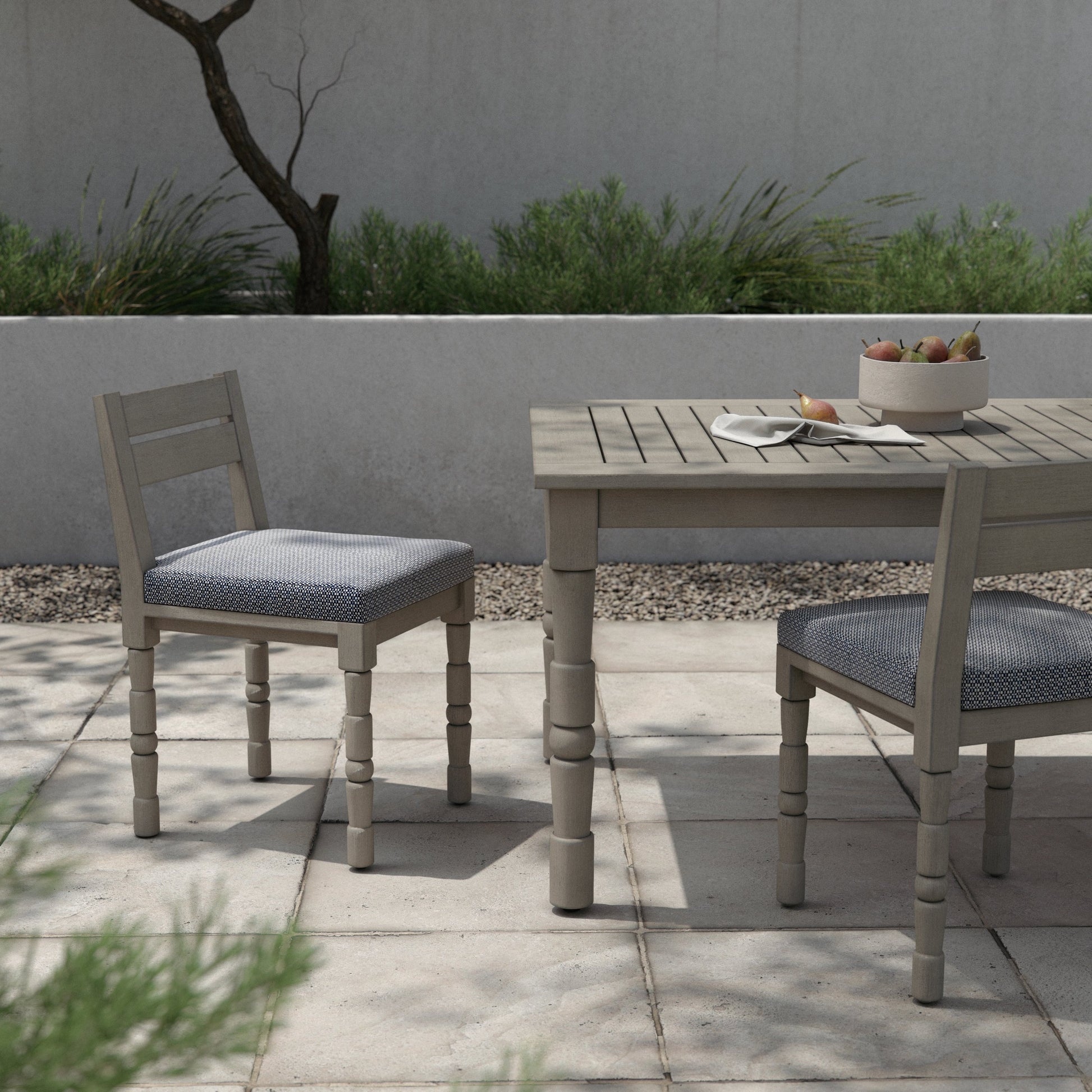 Waller Outdoor Dining Chair, Weathered Grey by Four Hands in weathered grey. Made from 100% olefin, solid fsc®-certified teak, 91% polyurethane foam pad, 9% polyester fiber batting in a transitional style.