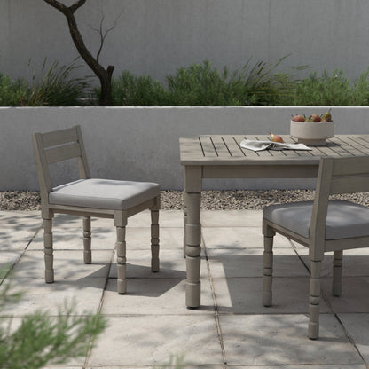 Waller Outdoor Dining Chair, Weathered Grey by Four Hands in weathered grey. Made from 100% olefin, solid fsc®-certified teak, 91% polyurethane foam pad, 9% polyester fiber batting in a transitional style.