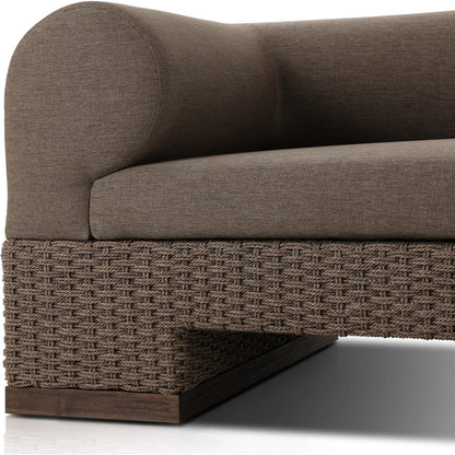 Joss Outdoor Sofa by Four Hands. Made from 100% olefin, solid teak, 100% polyethylene in a coastal style.
