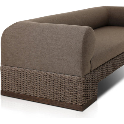 Joss Outdoor Sofa by Four Hands. Made from 100% olefin, solid teak, 100% polyethylene in a coastal style.
