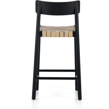 Heisler Counter Stool by Four Hands in almond leather and black. Made from 70% split leather, 30% polyvinyl chloride (pvc), solid ash, ash veneer in a transitional style.