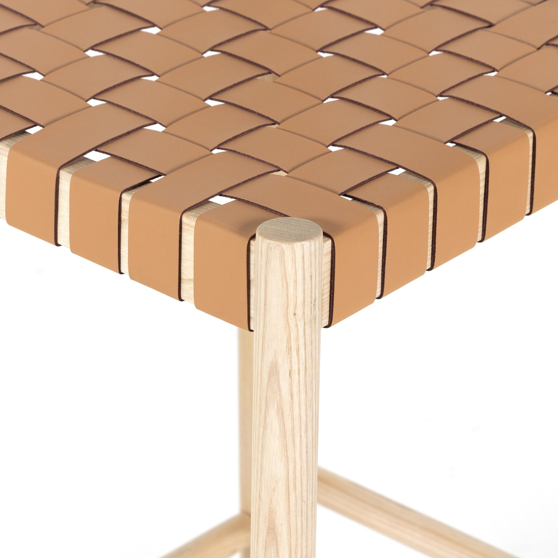 Heisler Counter Stool by Four Hands in almond leather and black. Made from 70% split leather, 30% polyvinyl chloride (pvc), solid ash, ash veneer in a transitional style.