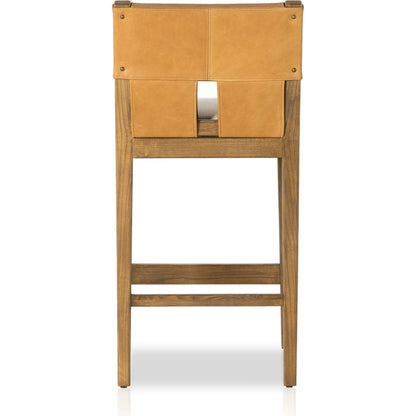 Sem Counter Stool by Four Hands in palermo butterscotch, lamont nettlewood, halcyon ivory. Made from 92% polyester, 8% flax, linen, solid nettlewood, top grain leather in a modern style.