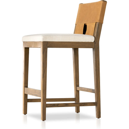Sem Counter Stool by Four Hands in palermo butterscotch, lamont nettlewood, halcyon ivory. Made from 92% polyester, 8% flax, linen, solid nettlewood, top grain leather in a modern style.