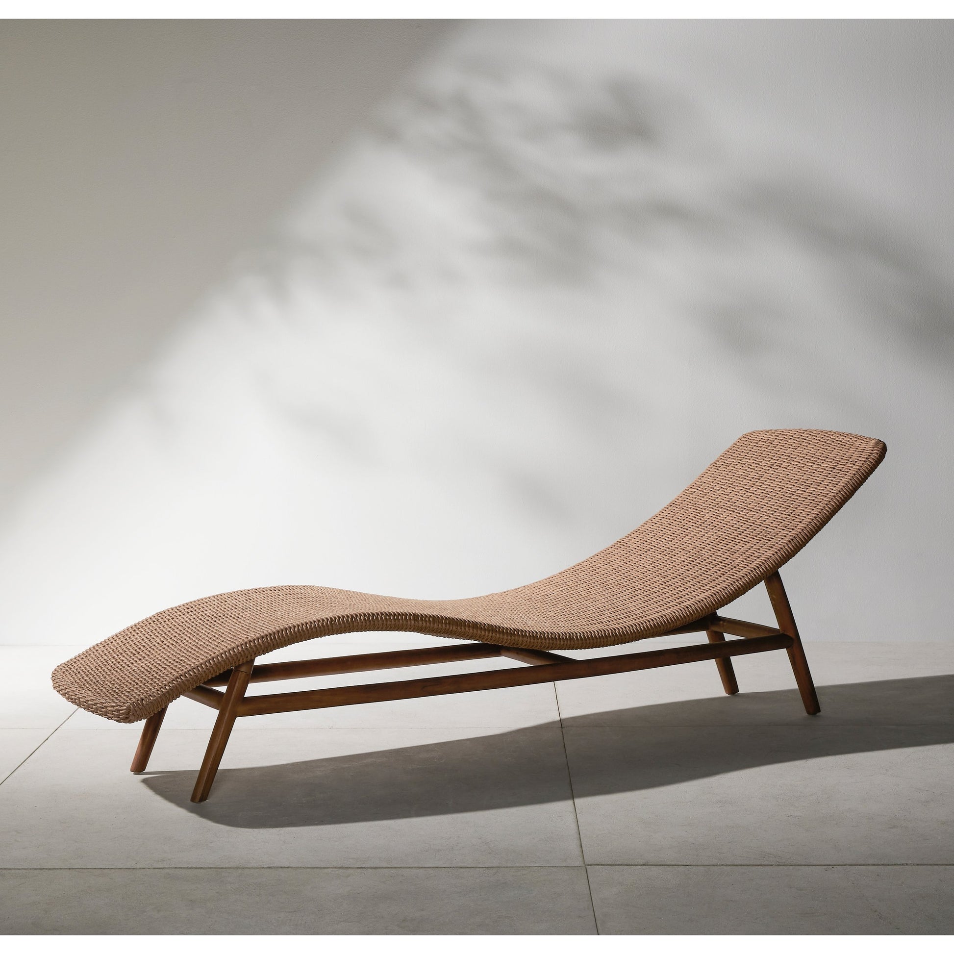 Portia Outdoor Chaise by Four Hands. Made from 100% polyethylene, solid teak, iron in a coastal style.