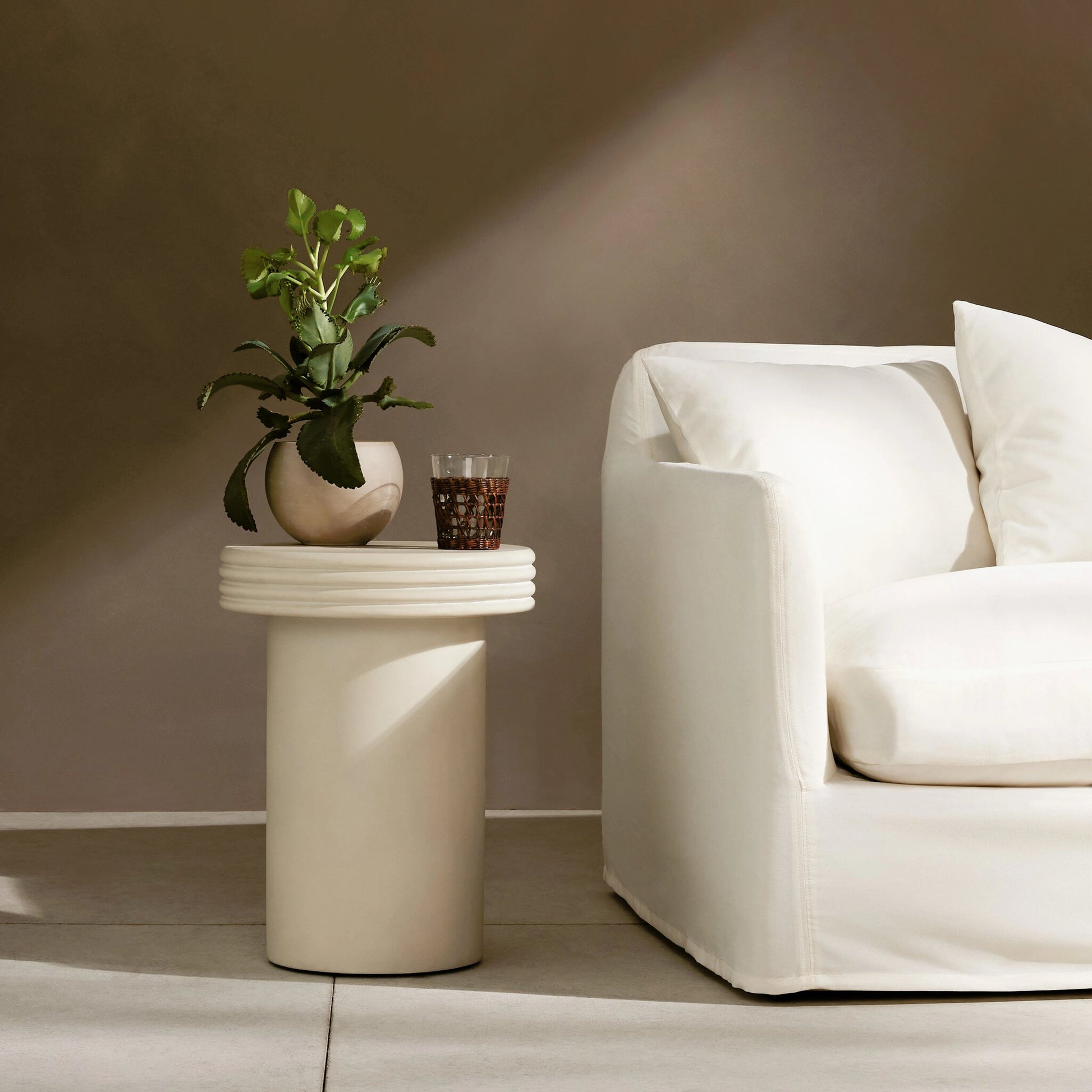 Grecia Outdoor End Table by Four Hands in white. Made from concrete in a modern style.