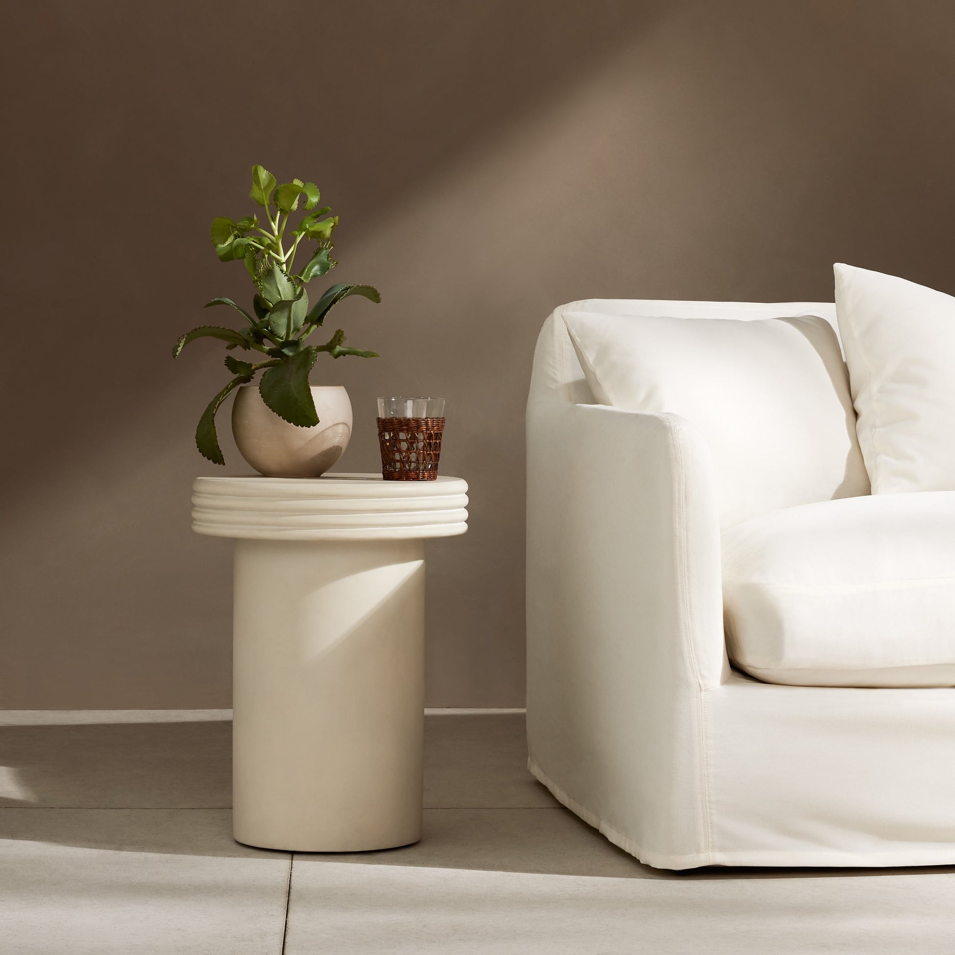 Grecia Outdoor End Table by Four Hands in white. Made from concrete in a modern style.