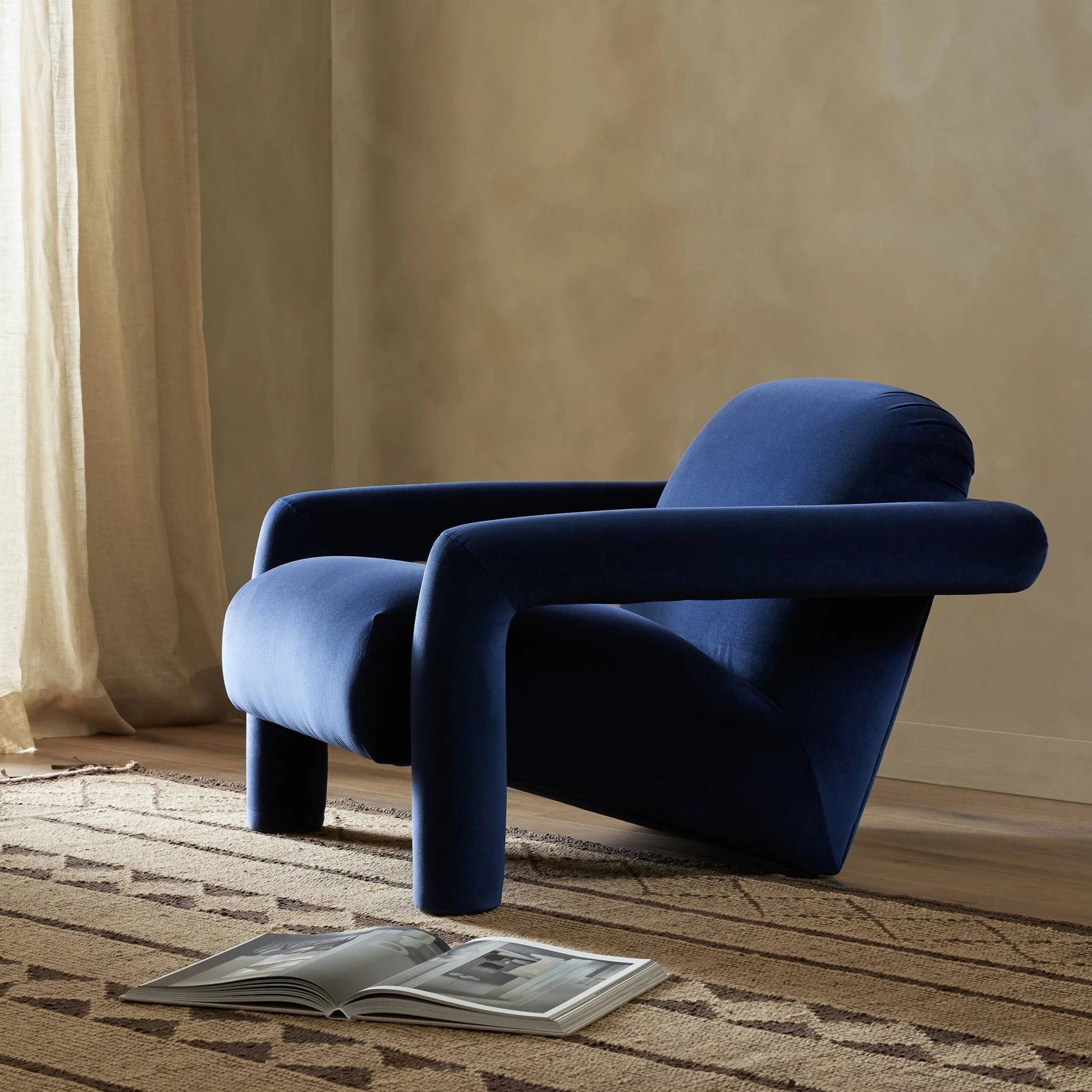 Jordy Chair by Four Hands in sapphire navy. Made from 92% polyester, 5% cotton, 3% latex, poplar plywood, 100% polyester in a modern style.