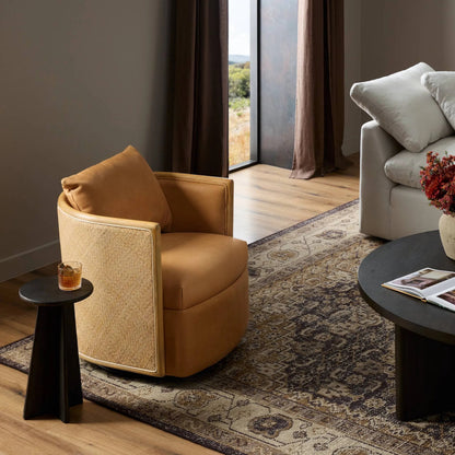 Newbury Swivel Chair by Four Hands in palermo cognac. Made from top grain leather, solid beech, cane in a modern style.