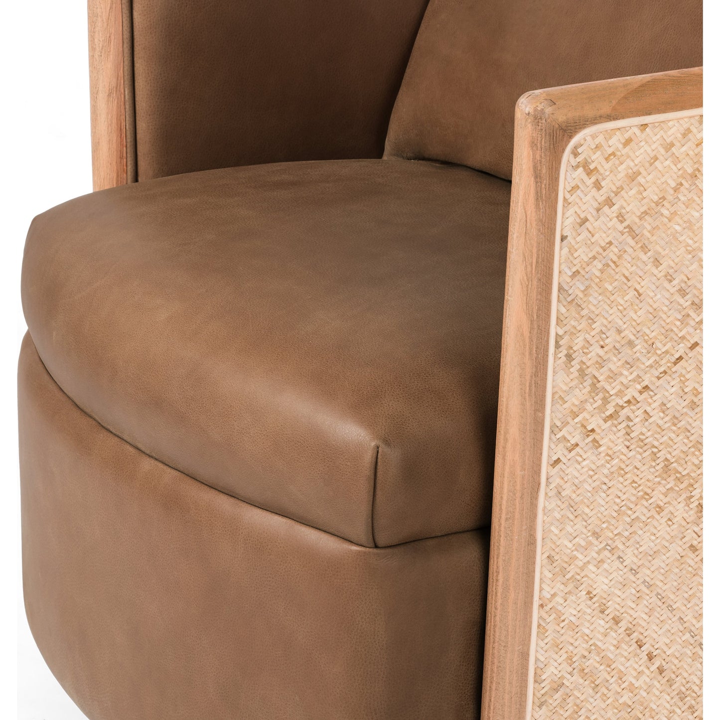 006 SI-1798581 | Closeup | Newbury Swivel Chair by Four Hands in palermo cognac. Made from top grain leather, solid beech, cane in a modern style.