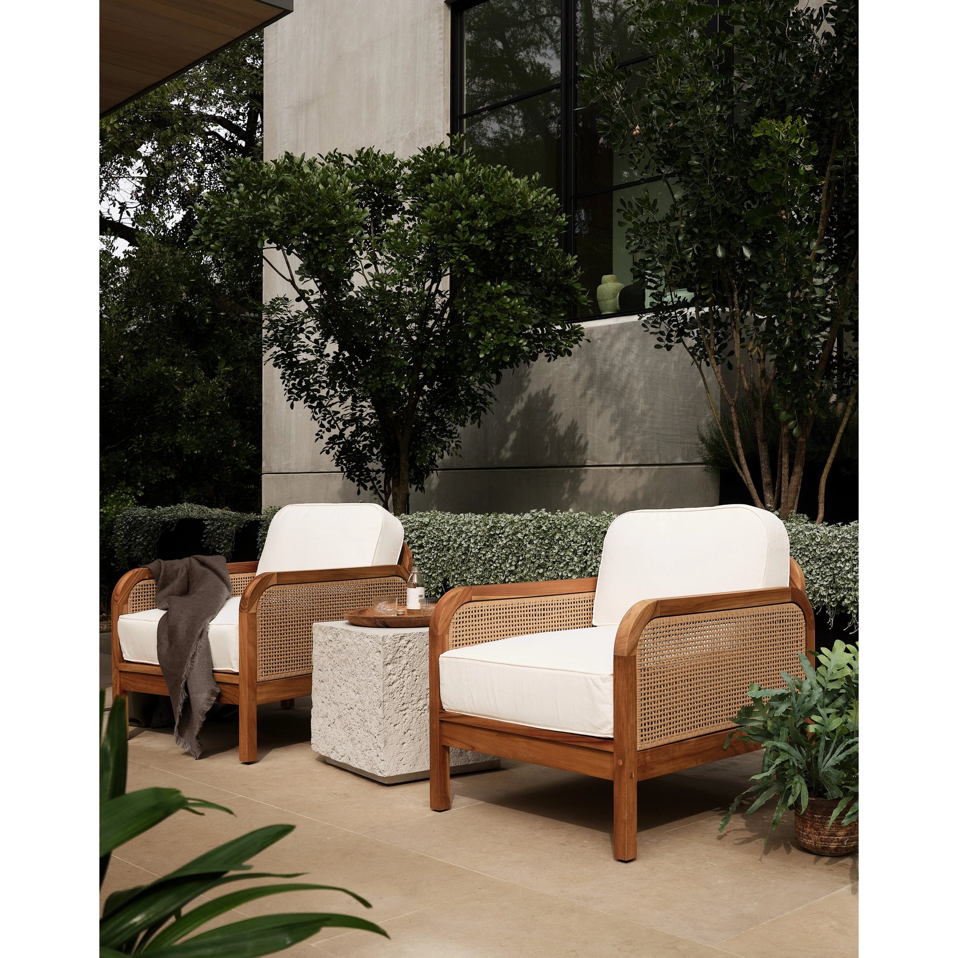 Merit Outdoor Chair by Four Hands in natural ivory and natural teak. Made from 100% olefin, solid fsc®-certified teak, 100% polyethylene in a coastal style.