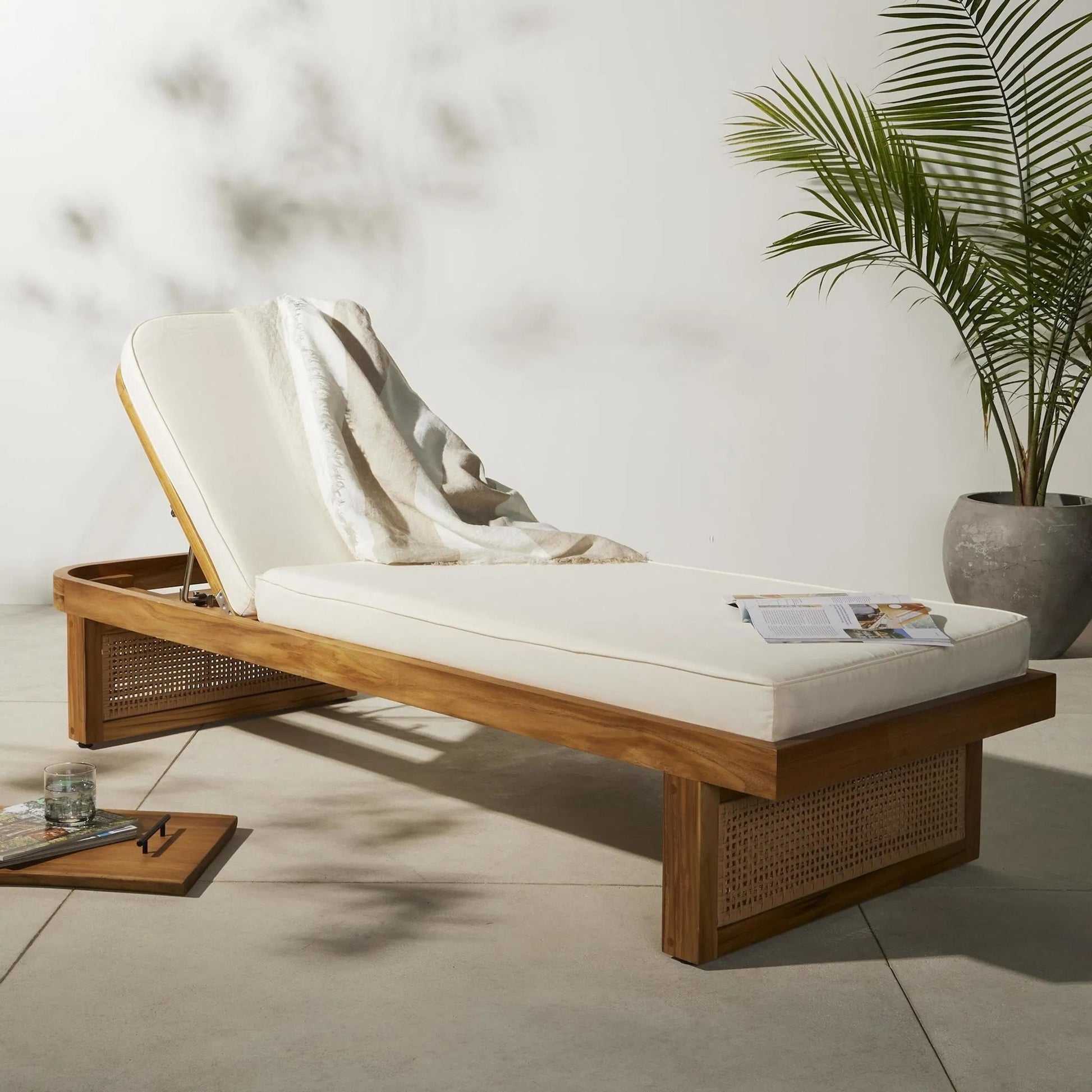 Merit Outdoor Chaise Lounge by Four Hands in natural ivory and natural teak. Made from 100% olefin, solid fsc®-certified teak, 100% polyethylene in a coastal style.