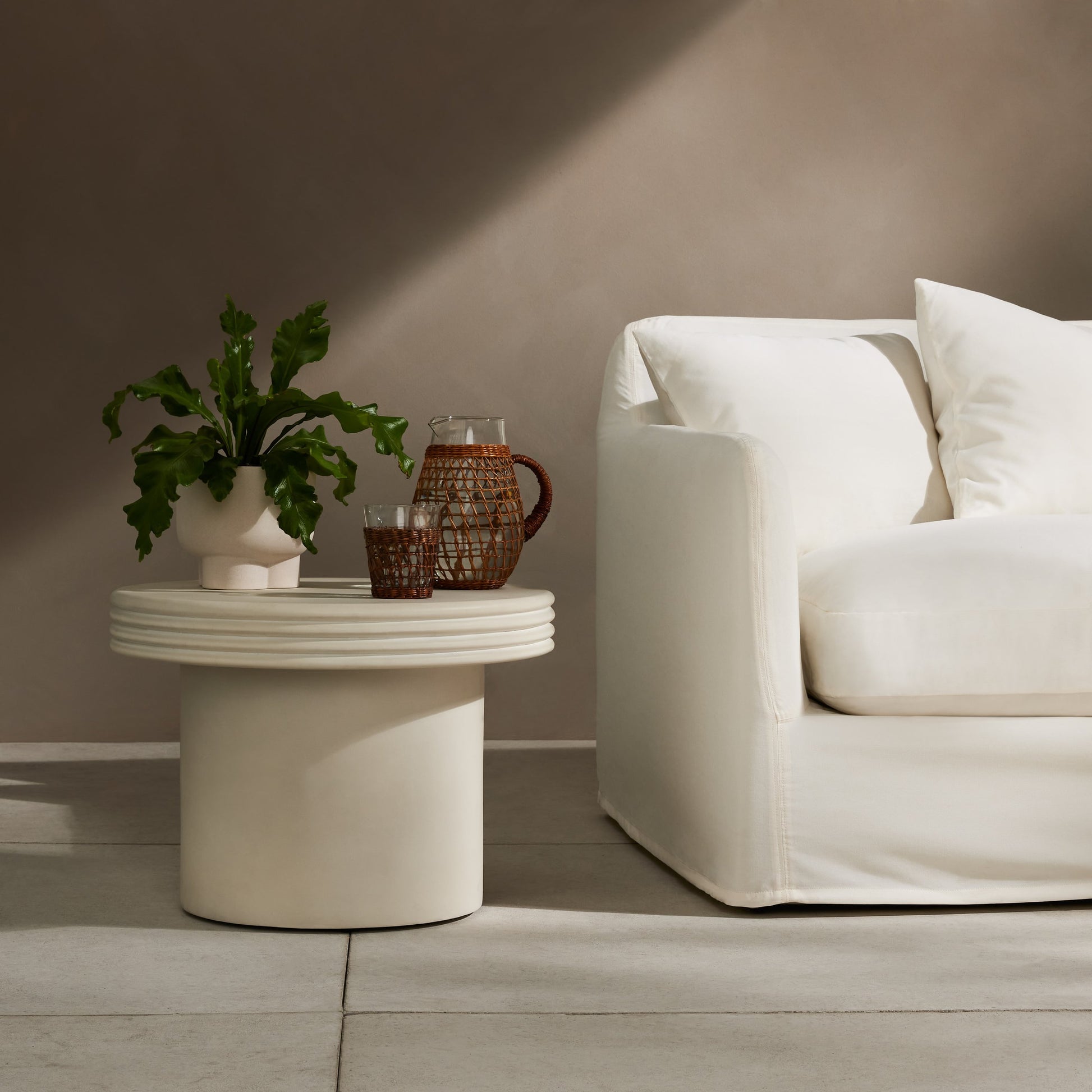 Grecia Outdoor End Table by Four Hands in white. Made from concrete in a modern style.