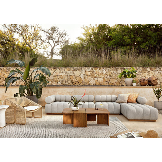 Roma Outdoor 4PC Sectional W/Ottoman by Four Hands in faye ash and natural teak. Made from 100% olefin, solid teak, 91% polyurethane foam pad, 9% polyester fiber batting in a modern style.