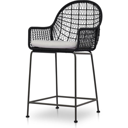 Bandera Outdoor Counter Stool with Cushion by Four Hands in smoke black. Made from 100% olefin, iron, 100% polyethylene in a coastal style.