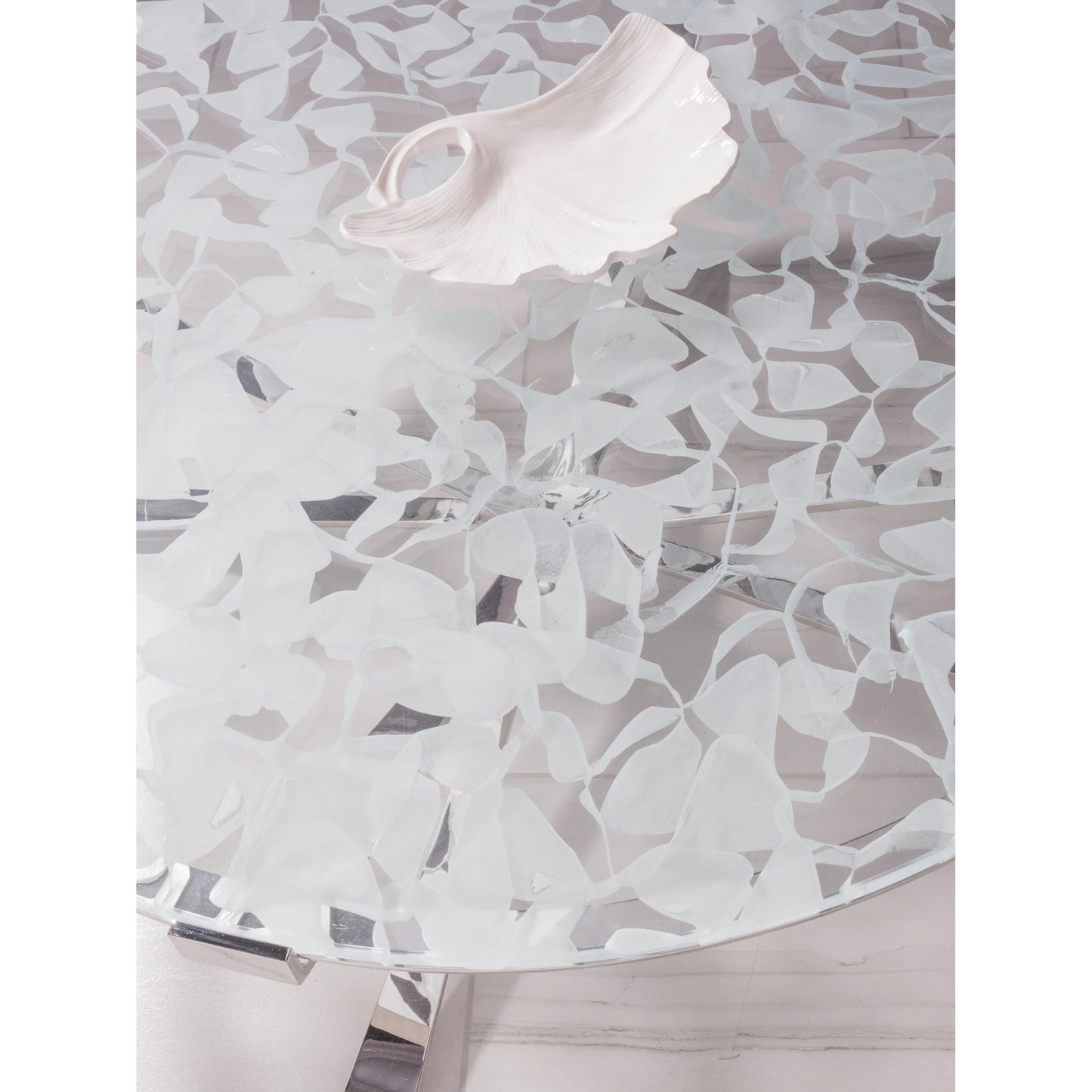 004 SI-1962908 | Closeup | Snowscape Round Cocktail Table by Artistica Home in polished stainless steel. Made from unique in a modern style.