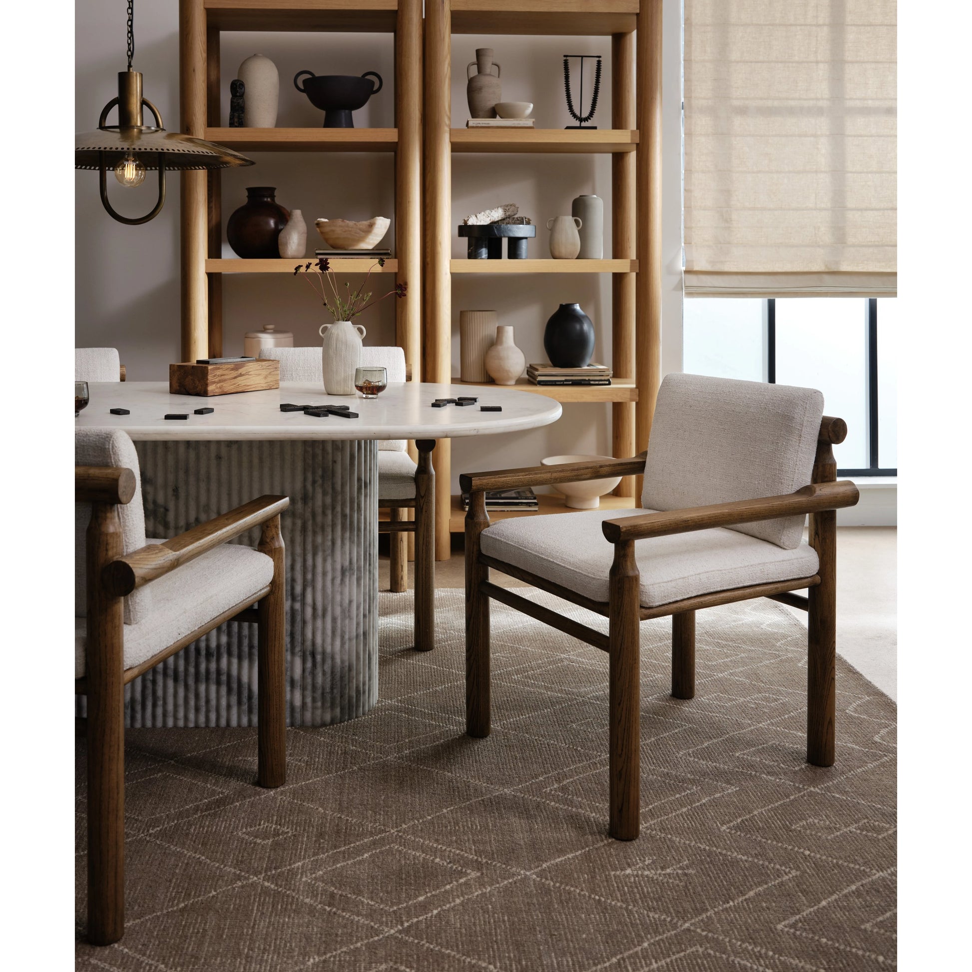 Oranda Dining Table by Four Hands in white scalloped marble, polished white marble w, sealant and white scalloped marble, polished white marble. Made from solid marble in a modern style.